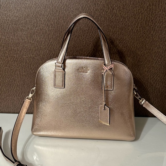 kate spade Handbags - Kate spade rose gold purse